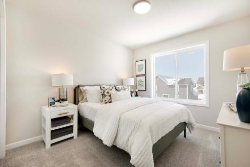 One of three upper level bedrooms (plus bedroom on main floor and lower level bedroom).