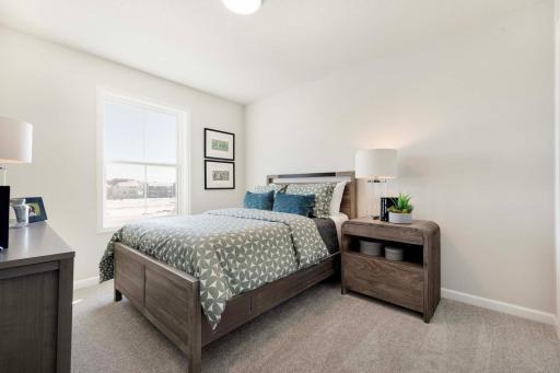 One of three upper level bedrooms (plus bedroom on main floor and lower level bedroom).