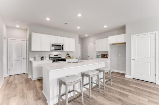 Photos are of the ELM floorplan of a previously decorated home. Actual home has an unfinished walkout basement and is under construction.