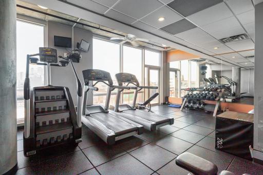 Exercise room with windows overlooking North Loop.