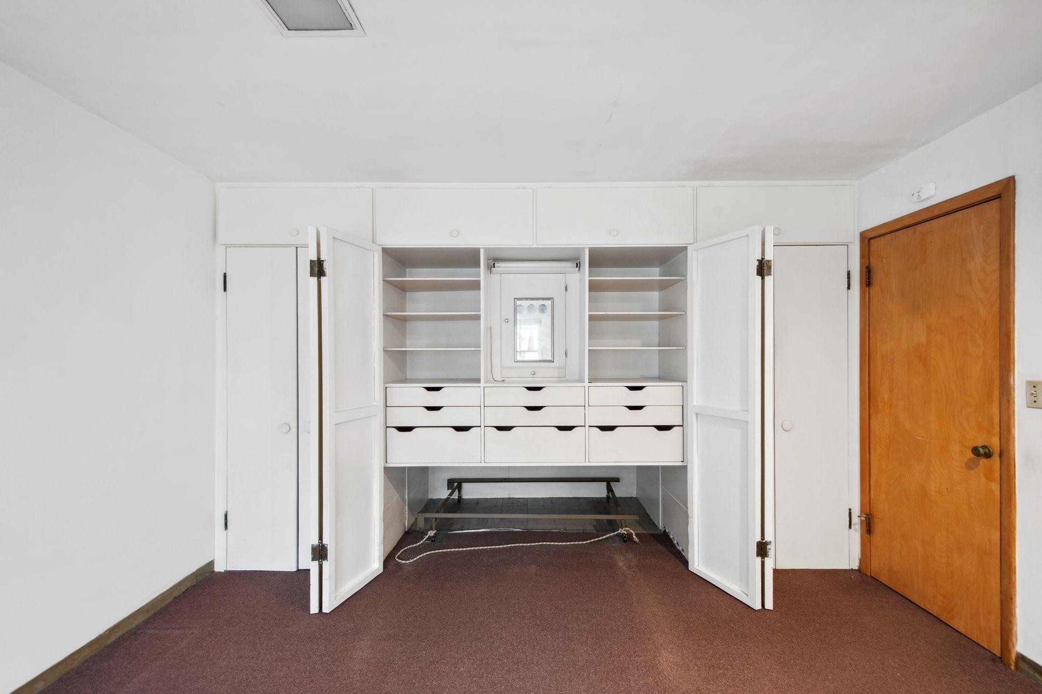 Built-in closets on the first floor - this space is big enough to have a pull out bed.