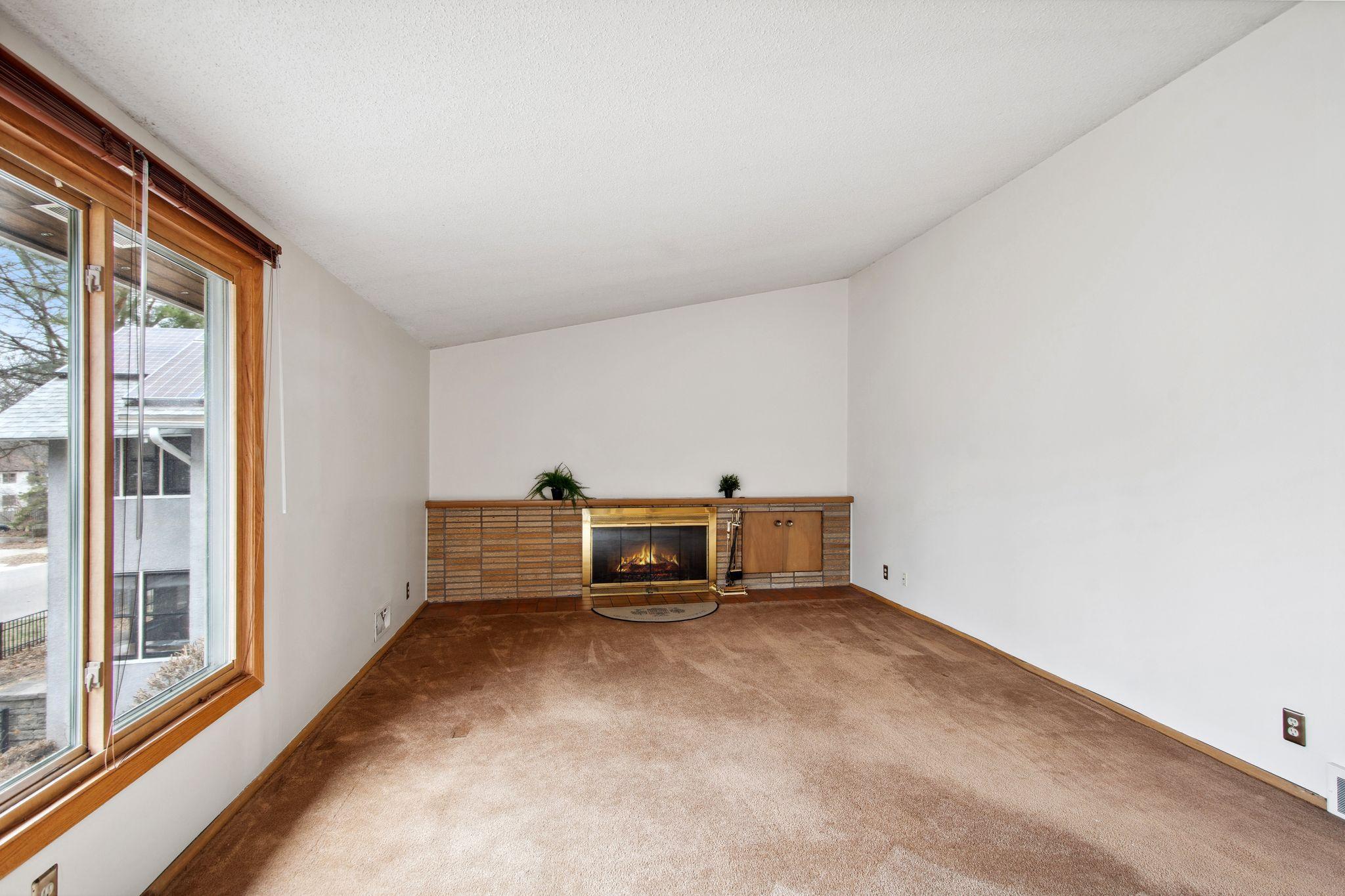 Living room with wood burning fireplace