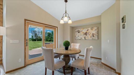 Sliding patio door with easy access to maintenance free deck, perfect for dining al fresco