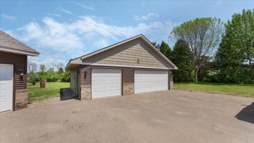 32 x 28 detached garage with shake/lap vinyl siding and decorative brick