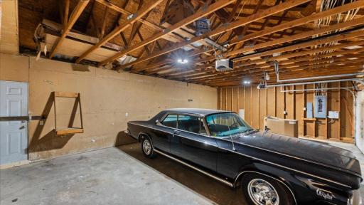 Attached 3 car garage with 24' deep double doors, and 22' single door