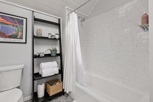 Tile shower in the upper level full bath.