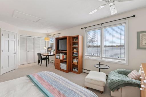 One of two upper level bedrooms with 4 windows facing the lake. 2 closets including a walk-in.