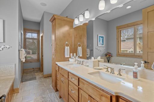 Double vanity and cabinet offer exceptional storage and functionality