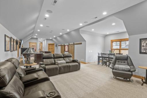 Upper level is complete with living and dining areas in addition to the wet bar