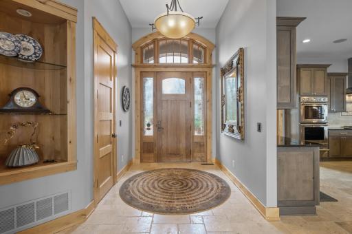 Arched windows in entryway are mirrored throughout for maximum natural light