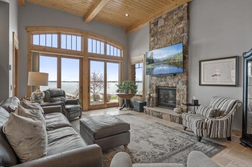 Floor to ceiling fireplace maintains a rustic touch to this renovated home