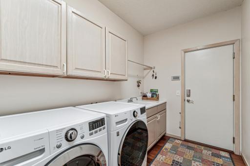 Main floor laundry/mudroom leads to the two car garage.