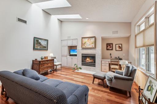 The den/family room offers a second living area on the main level. Skylights provide extra daylight.