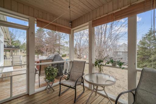 Enjoy the outdoors without the bugs in the screened porch.