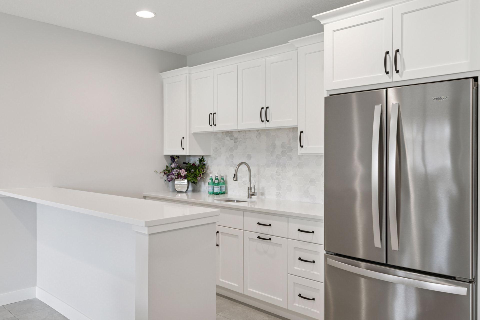 Elegant finishes enhance this wet bar, offering added convenience for entertaining.