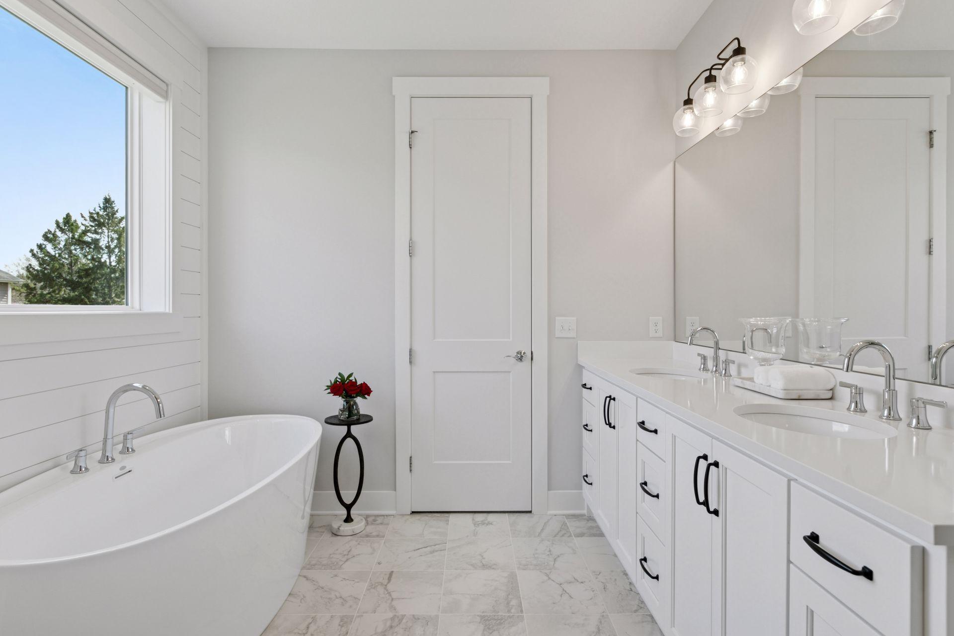 Luxurious primary en-suite bath with a soaking tub.