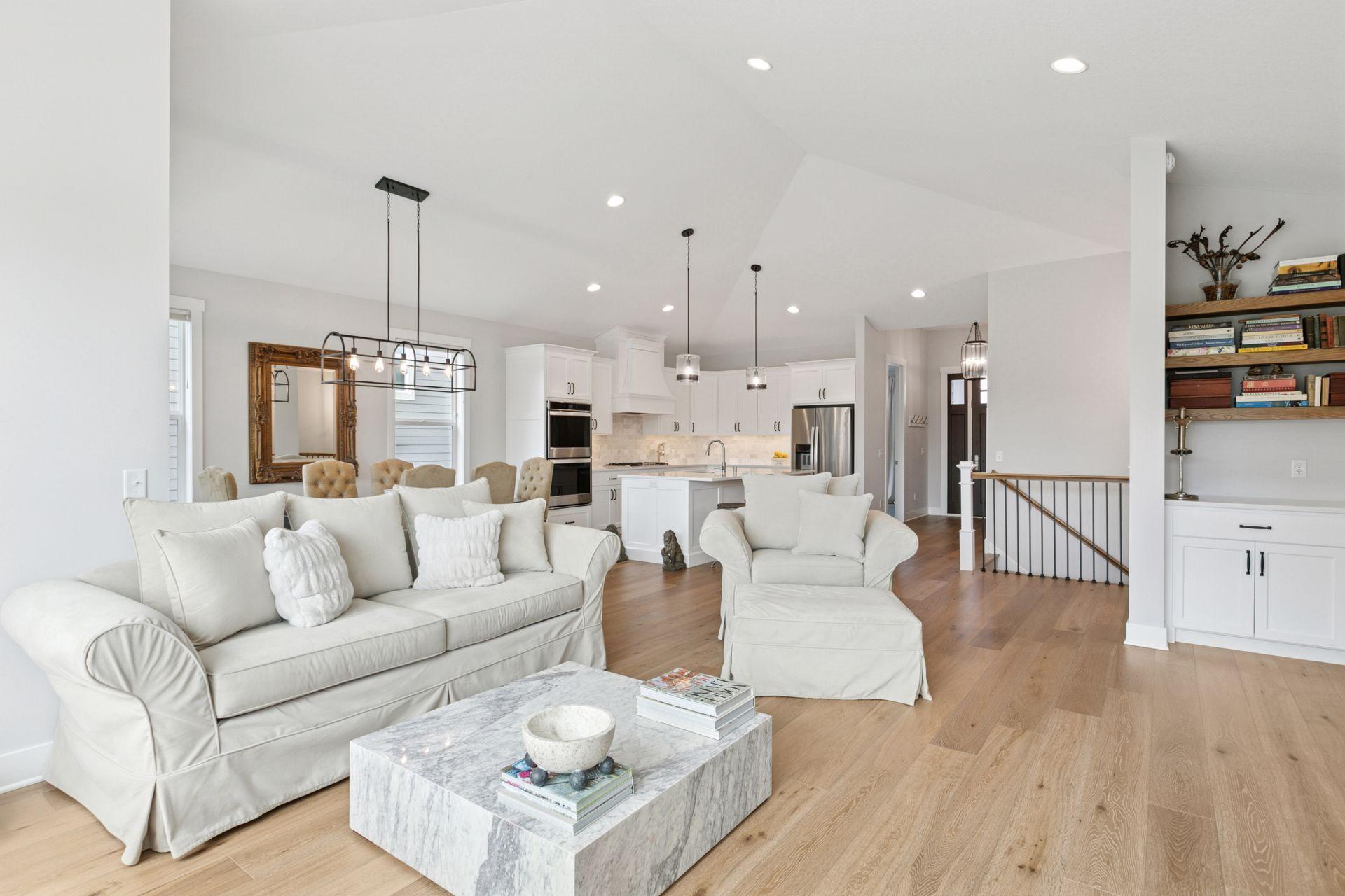 Built with both beauty and functionality in mind, this home showcases striking architectural details, a vaulted great room with fireplace, and a gourmet kitchen with refined appliances and finishes.