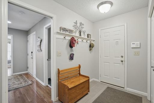 Conveniently located off the garage, this spacious mudroom doubles as a laundry area with built-in cabinetryâideal for daily organization and functionality.