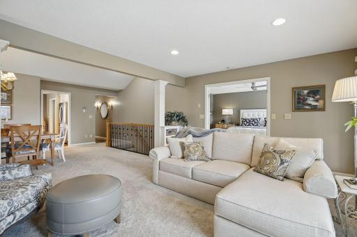 From the living room, enjoy a clear view into the vaulted dining room and through the French doors leading to the spacious main-floor ownerâs suiteâcreating a seamless and inviting flow throughout the home.