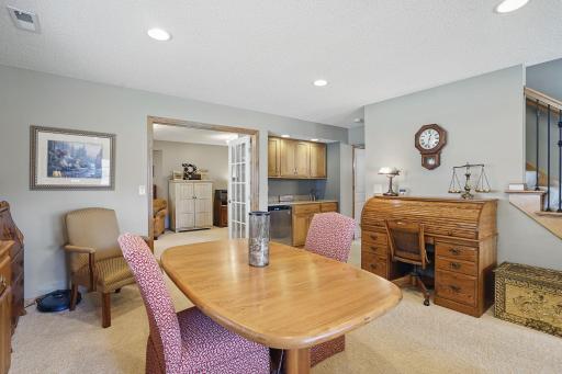 Just off the table area, French doors lead to a versatile bedroom currently used as an officeâoffering flexibility for work-from-home needs or guest space.