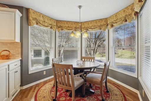 Sunny and inviting, this informal dining space is surrounded by a circle of windows that fill the room with natural lightâan ideal spot to enjoy your morning coffee or a casual meal.