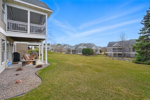 A side angle of the home highlights the spacious backyard and landscaped surroundingsâproviding plenty of outdoor space with a peaceful, open feel.