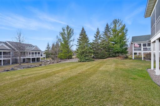 The backyard opens to a nicely landscaped greenspace with neighboring homes set at a comfortable distanceâoffering a sense of openness and added privacy.