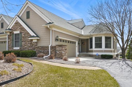 A closer look at the front reveals beautiful stonework along the side of the garage, adding to the homeâs curb appeal and showcasing the quality craftsmanship throughout.