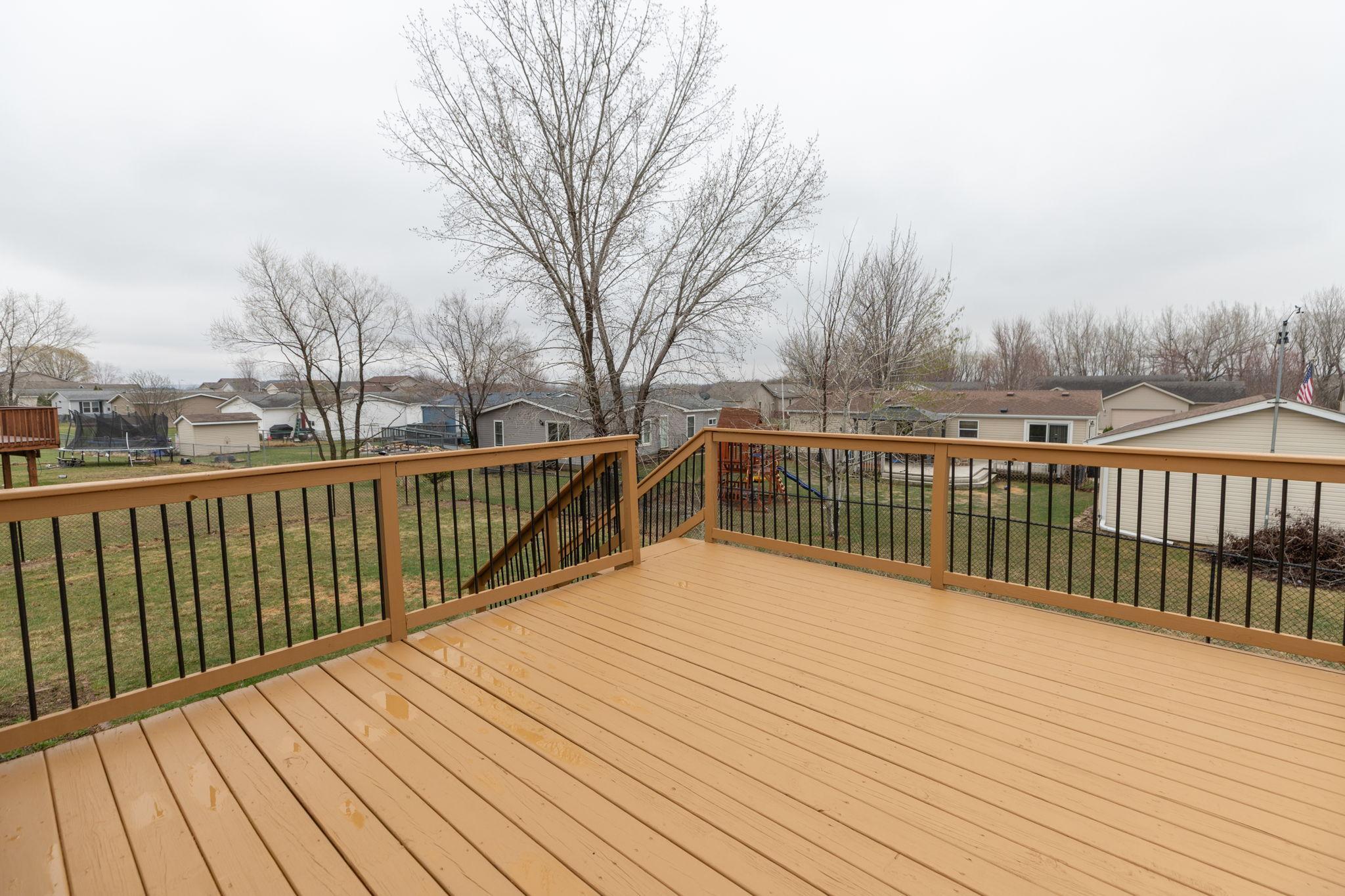 Large Deck overlooking fenced backyard