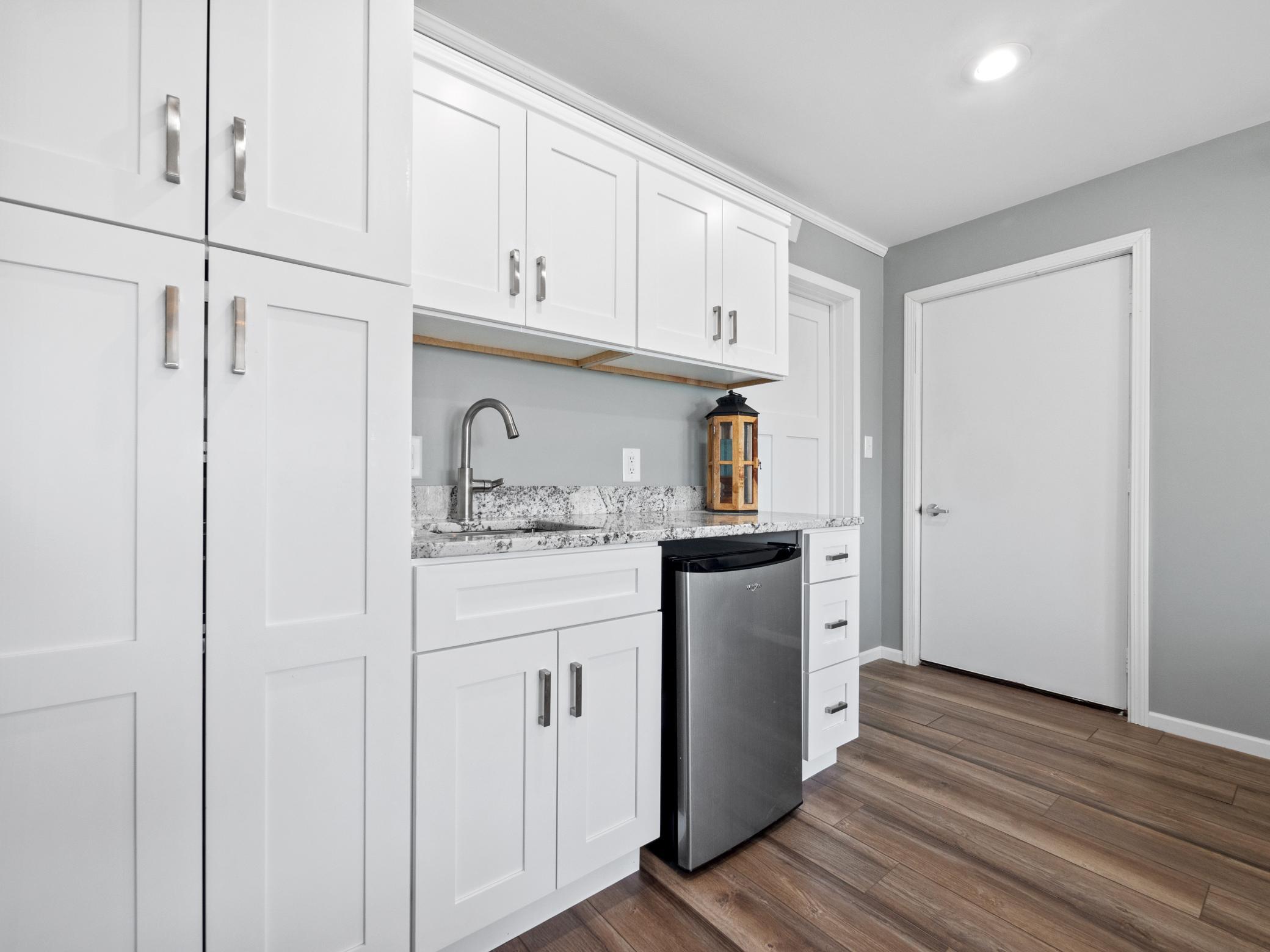 There is even granite countertops! Door to the right goes to the shed.