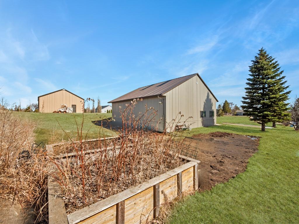 For the garden enthusiasts, there are raised garden beds and a large area on the ground for all of your plantings.