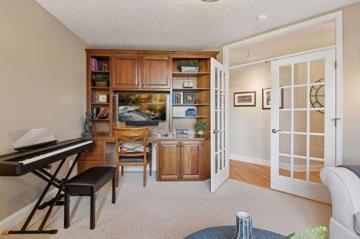 Step into the versatile den/office space, ideal for work, study, or simply unwinding in a quiet nook.