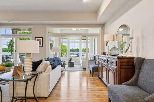 Unwind in the breathtaking sunroom, where expansive windows offer stunning views of St. Albans Bay.