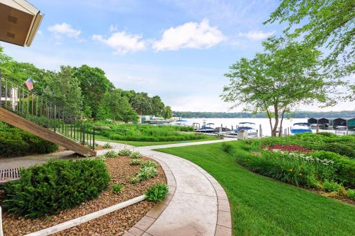 The beautifully landscaped backside of the unit leads you to a scenic path that takes you directly to your boat slip
