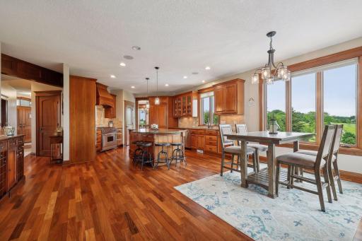 Newly refinished hardwood floors flow throughout the main level and lead into the chef's Kitchen.