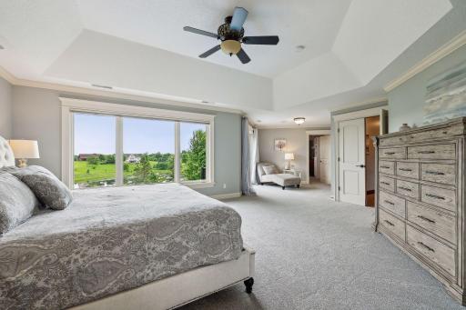 The spacious suite enjoys long views over the backyard and pond.