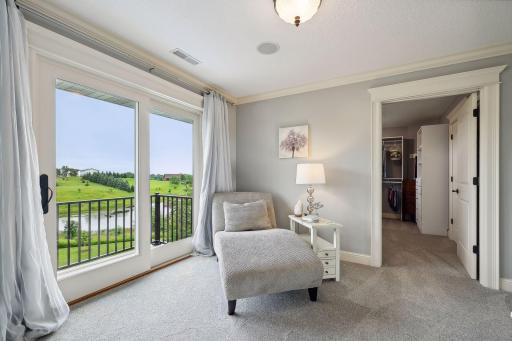 Relax in your private sitting room. Just behind the space is a large walk-in closet with custom organizer system.