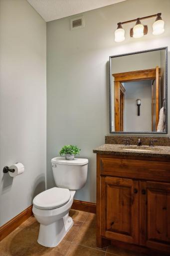 The lower level Powder Room is perfect for guests and pool days!