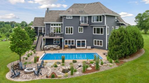 Surrounded by new professional landscaping, including 30 new trees, the backyard offers resort-style living with all the comforts of home.