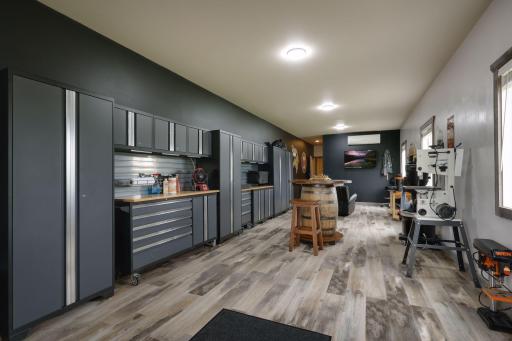 A finished workshop completes the outbuilding and features heat and AC. The cabinetry is not included in the sale of the property.