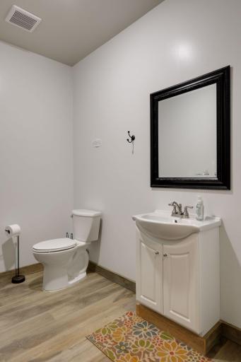 A half bathroom completes the outbuilding.