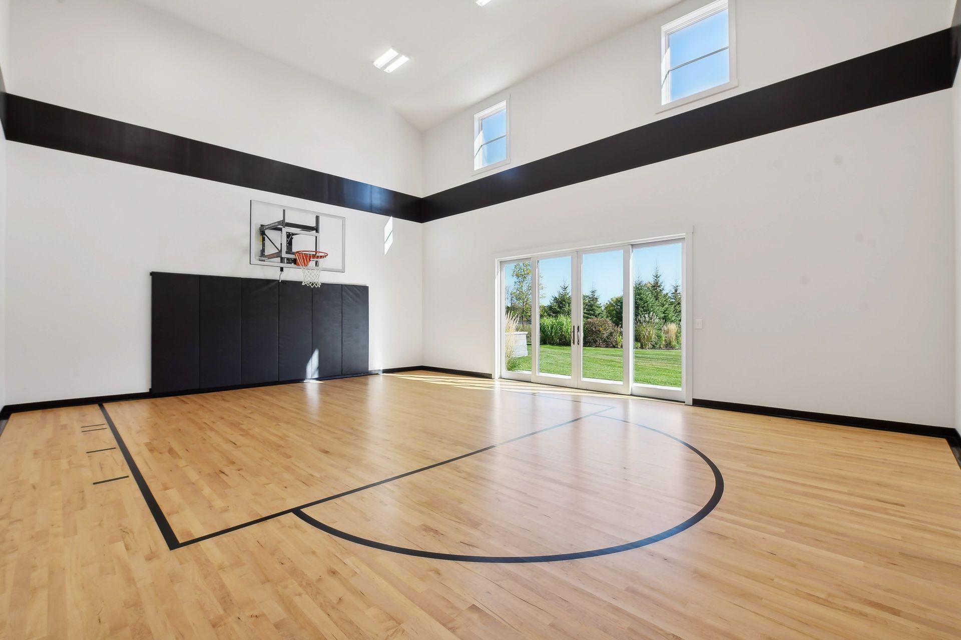 This sport court has been upgraded to NBA grade flooring. The sliding glass doors also were added to let more natural light in with additional access to the backyard.