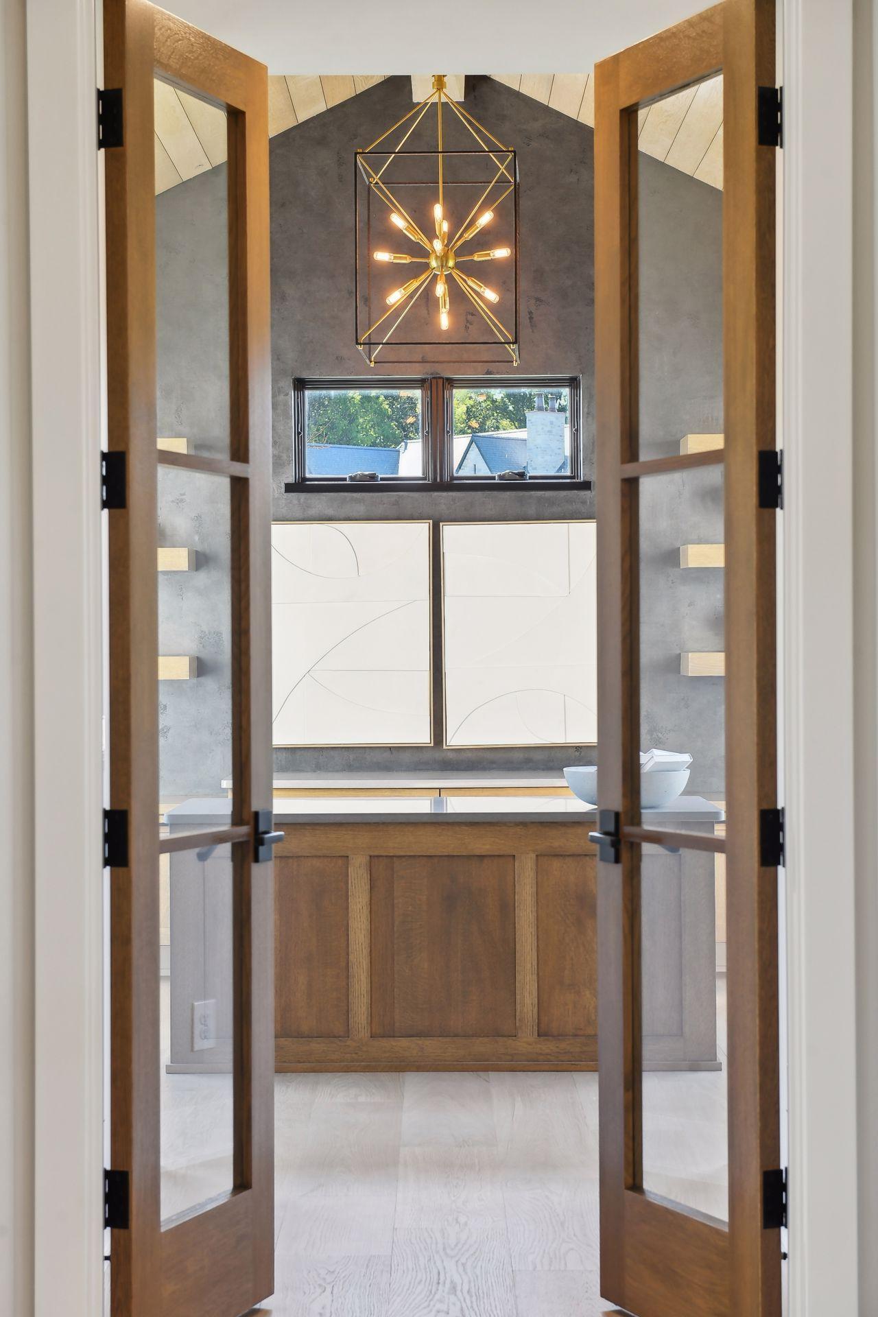 A French door entrance to a grand home office or flex space....