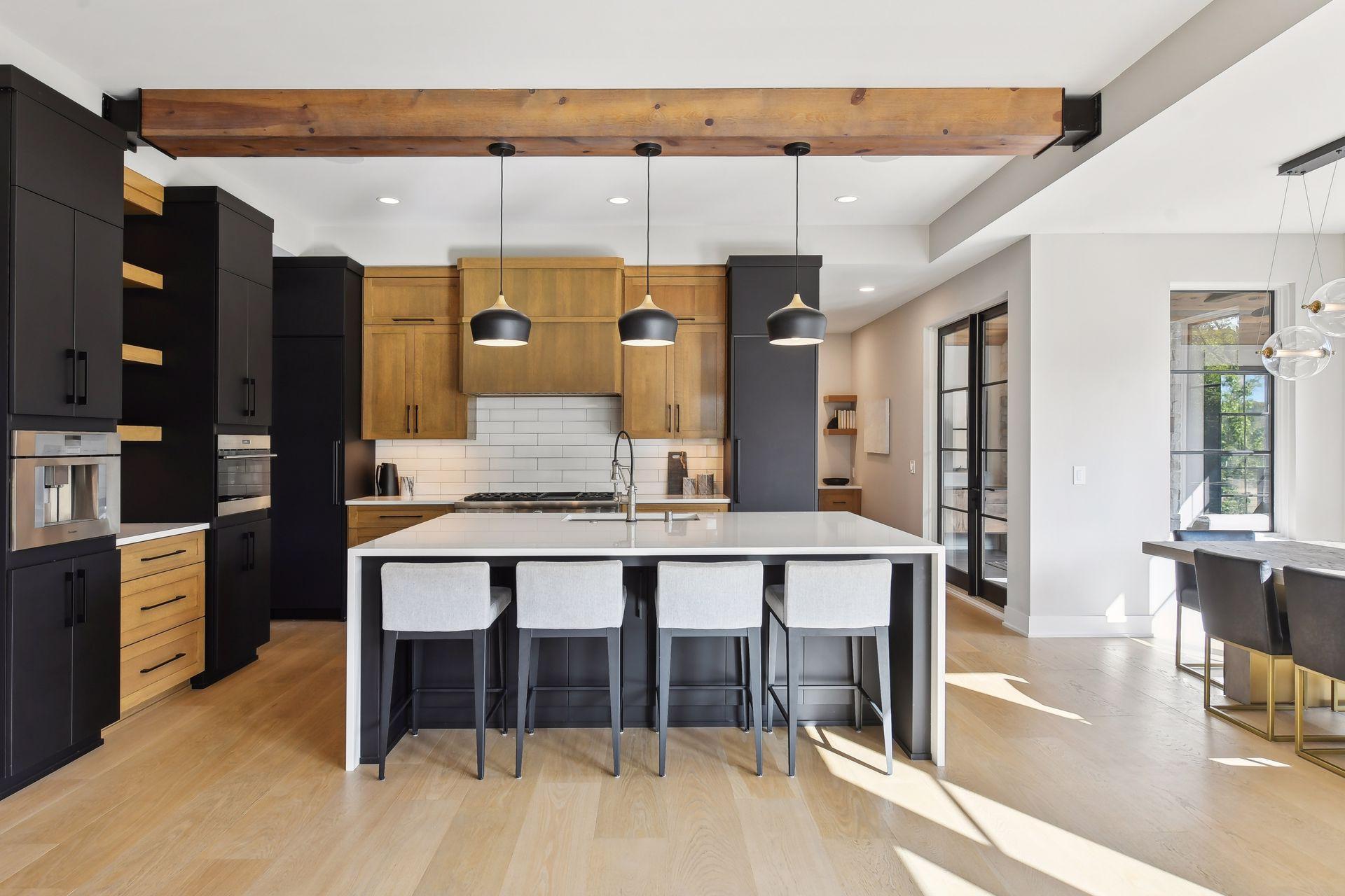 The kitchen design selection includes a stunning two tone kitchen mixing in a contemporary black....