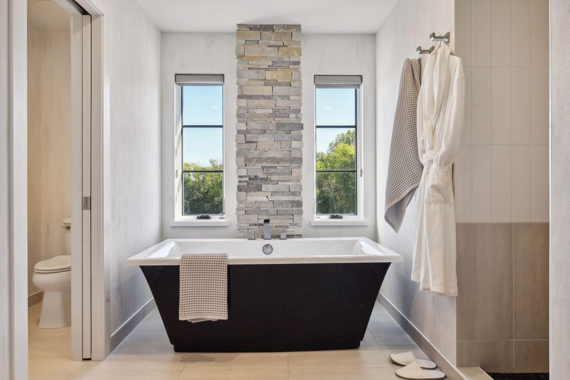 A soaking tub with a private nature view.