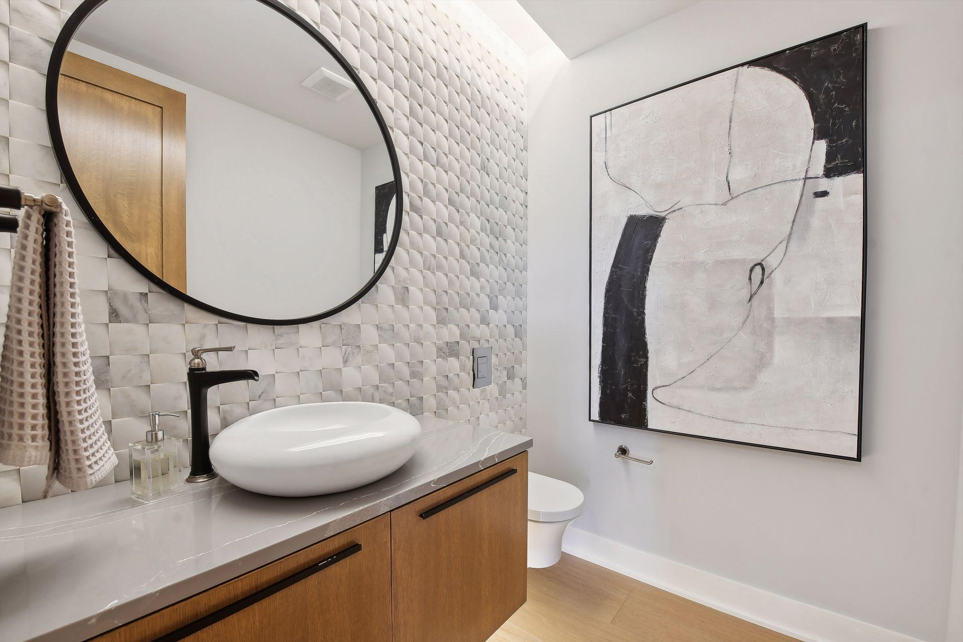 Floor to ceiling tile work in the main floor powder room is sure to make an impression!