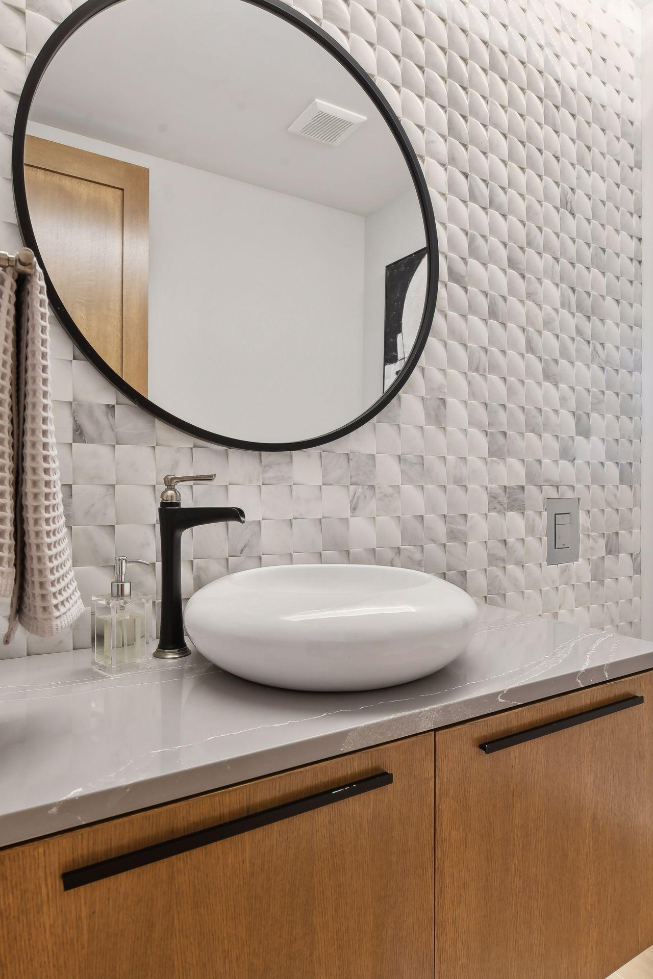 The curvature of both tile & sink make this a striking design choice.