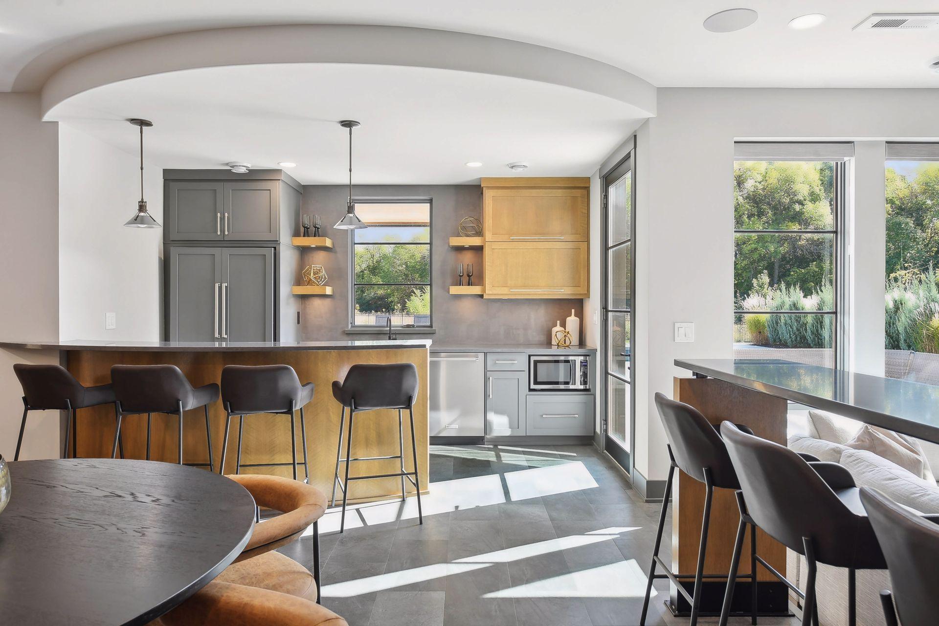 The warm wood tones are consistently carried throughout the home creating a cozy yet sleek look and feel.