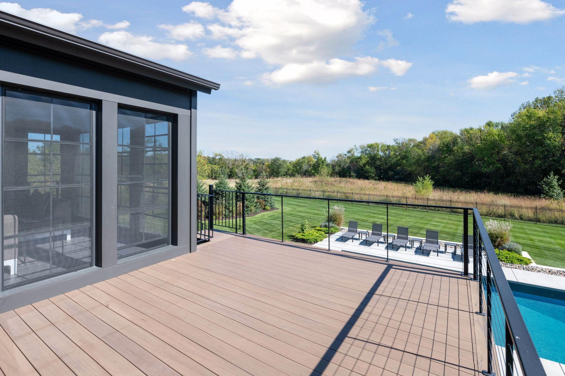 This sun soaked deck gives you great views of the expansive backyard and has a stunning spiral staircase that connects you with the lower pool deck.