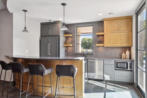 The basement bar & kitchen is ready for your next gathering.